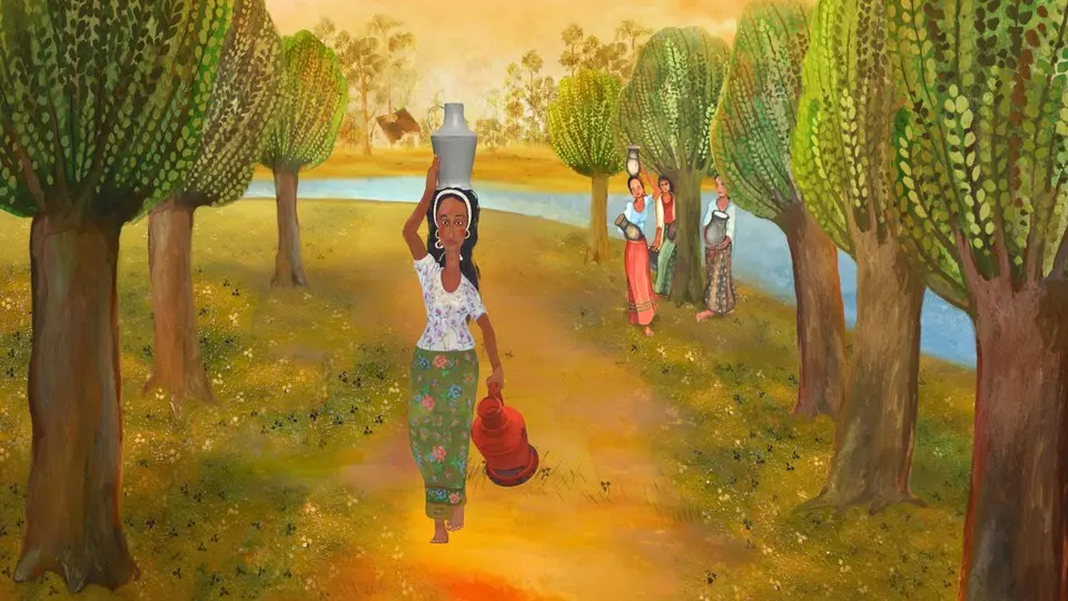 En kvinna som går på en stig och bär vatten.