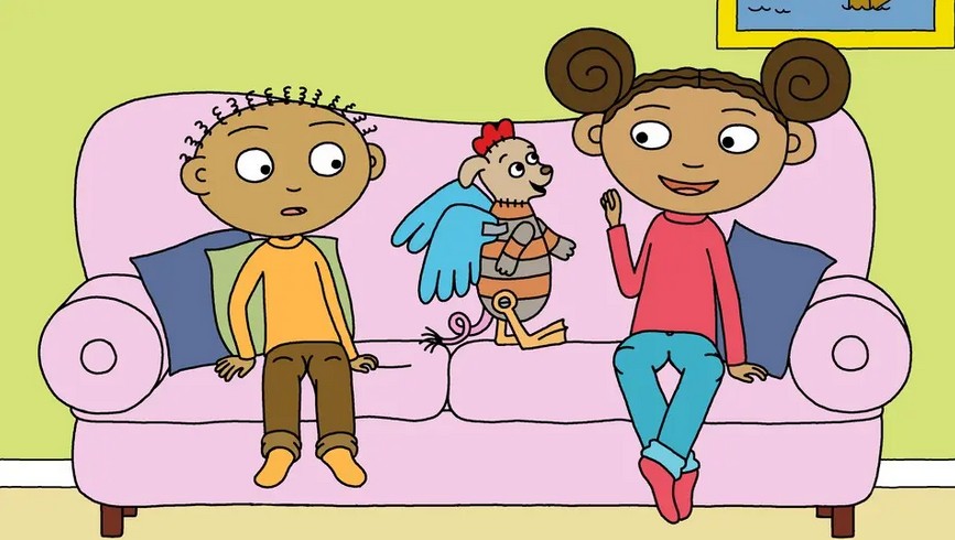 Två barn som sitter på en soffa.